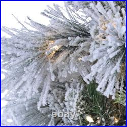 Sterling 9 ft. Pre-Lit Warm White Lightly Flocked Snowbell Pine Christmas Tree
